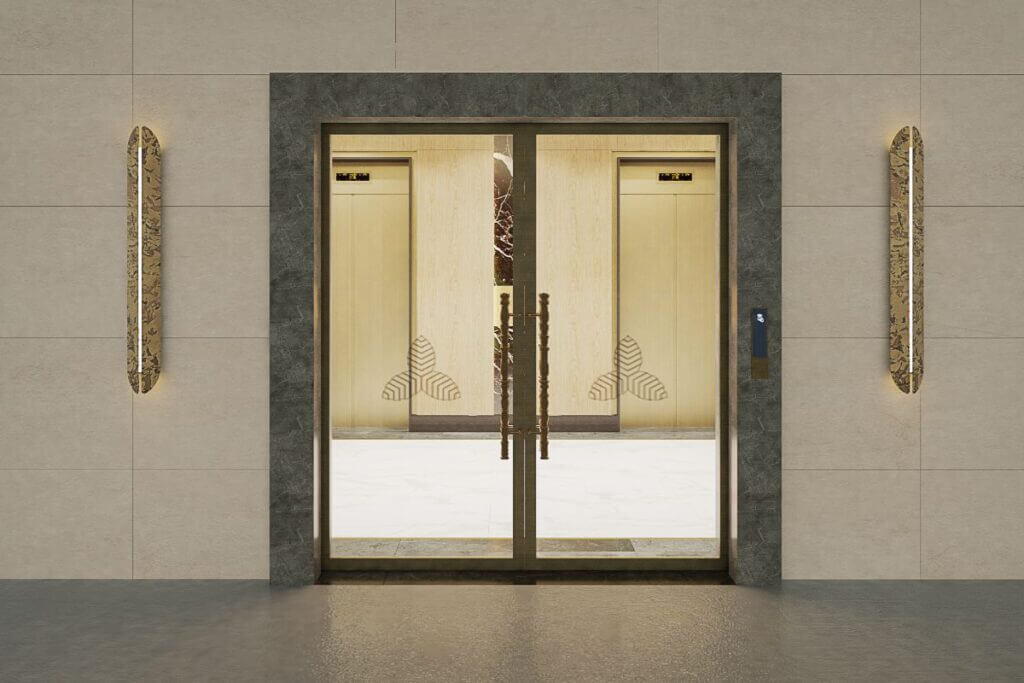 Set of glass double doors with silver handles, framed by grey stone molding in a minimalist interior.
