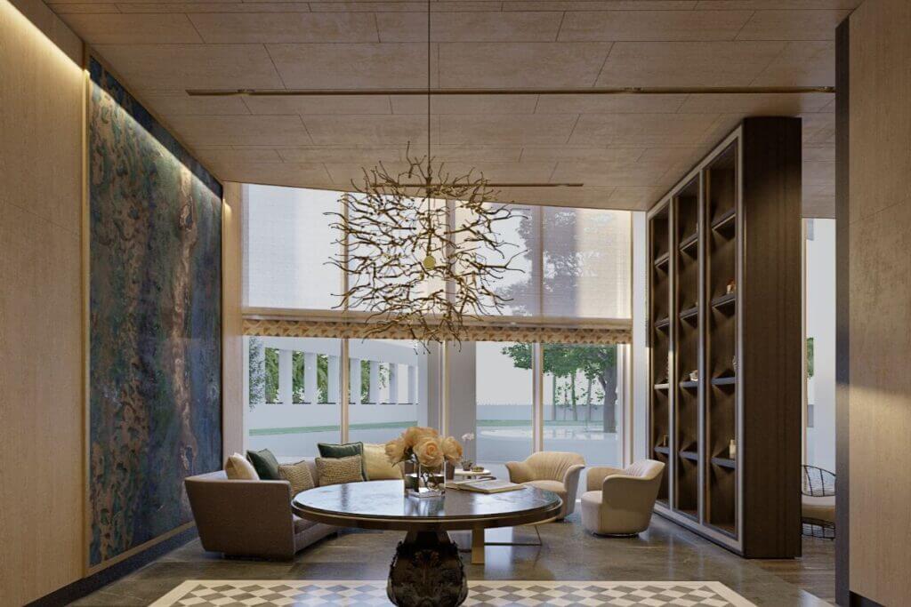 Grand high-ceilinged lounge with wooden built-in shelving, circular center table, and decorative branched chandelier.